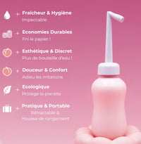 Douchette nomade intime rose surélevée, embout pulvérisateur blanc et base