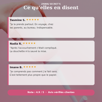 Douchette intime blanche avec embout, tenue près d’un récipient