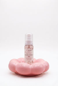 Brume intime 3 en 1 en flacon transparent à pompe, liquide rosé
