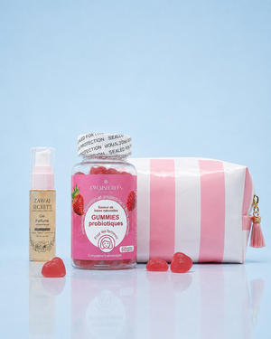 Flora Glow — gel parfumé petit format, gummies probiotiques en cœur et trousse rose rayée sur fond bleu ciel